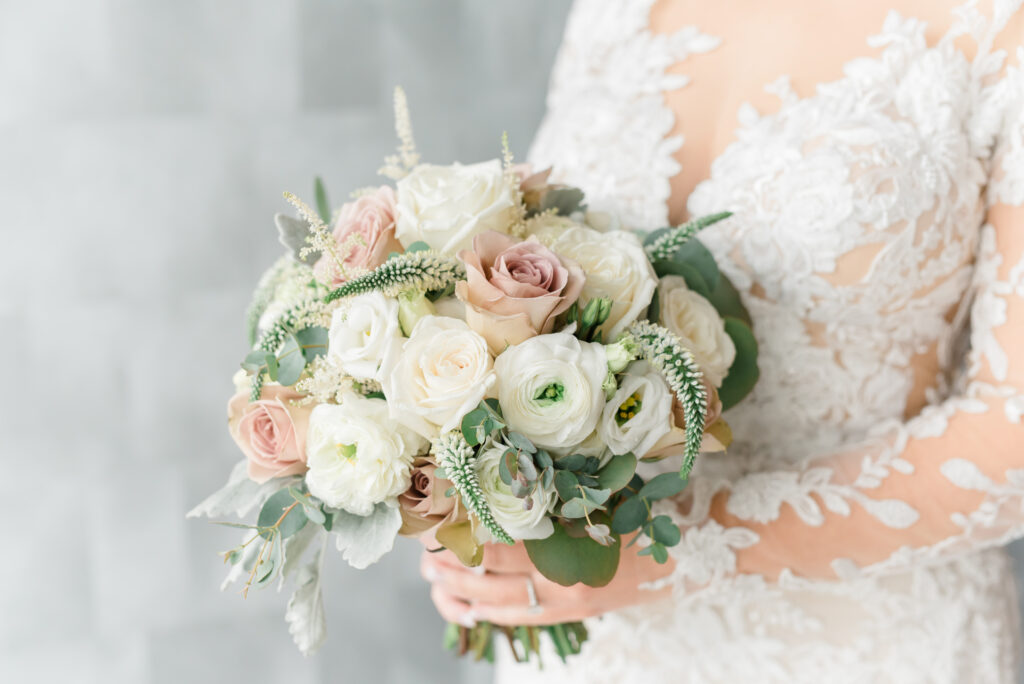 Bridal bouquet of Ranunculus and blush roses. 