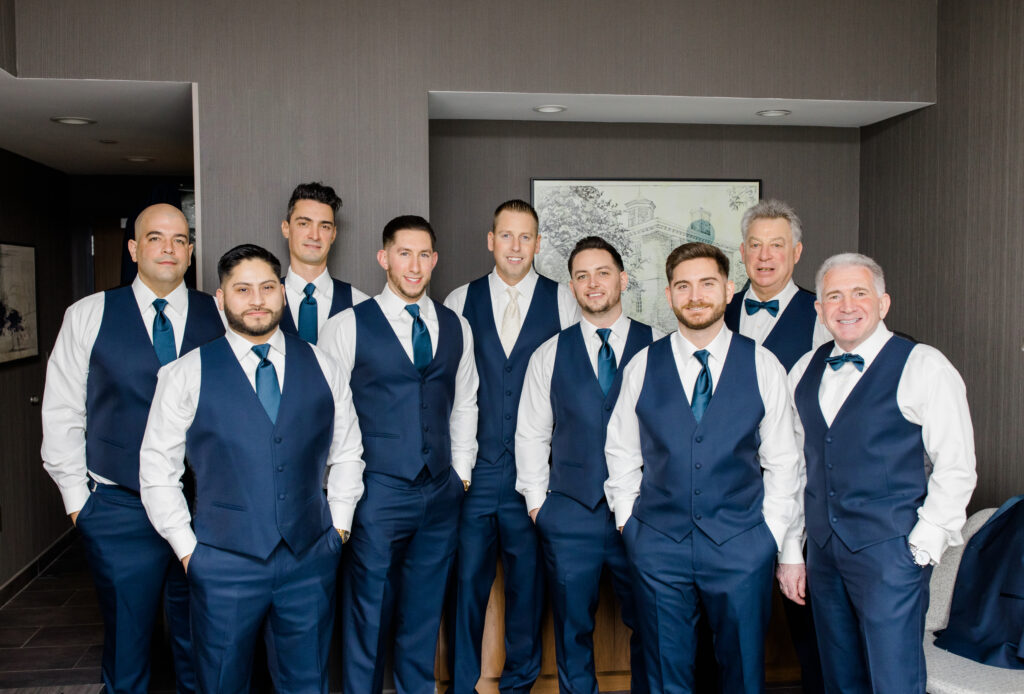 Groom and groomsmen getting ready for wedding 